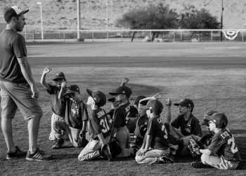 Little League Baseball Team With Coach