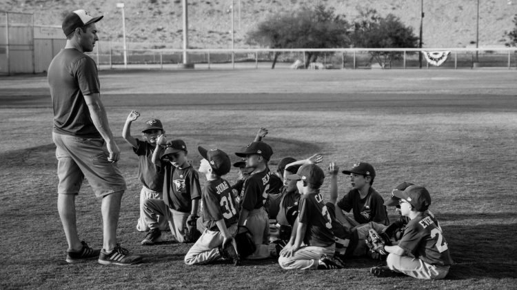Little League Baseball Team With Coach