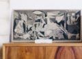 Guernica print sitting on a shelf
